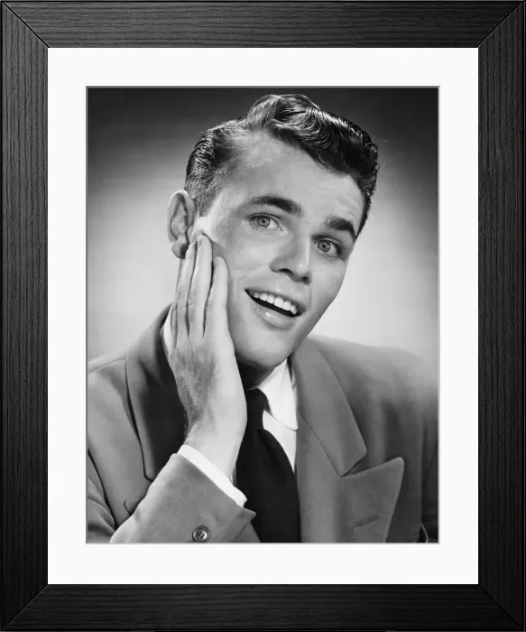 Framed Print : Young man with hand on cheek, posing in studio, (B&W), (Close-up), (Portrait) Framed Print : Young man with hand on cheek, posing in studio, (B&W), (Close-up), (Portrait)