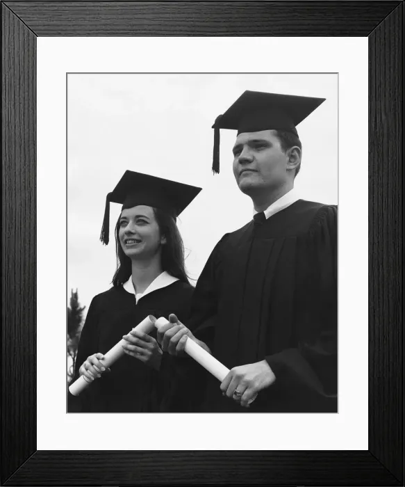 Framed Print : Man and woman in graduation caps and gowns Framed Print : Man and woman in graduation caps and gowns