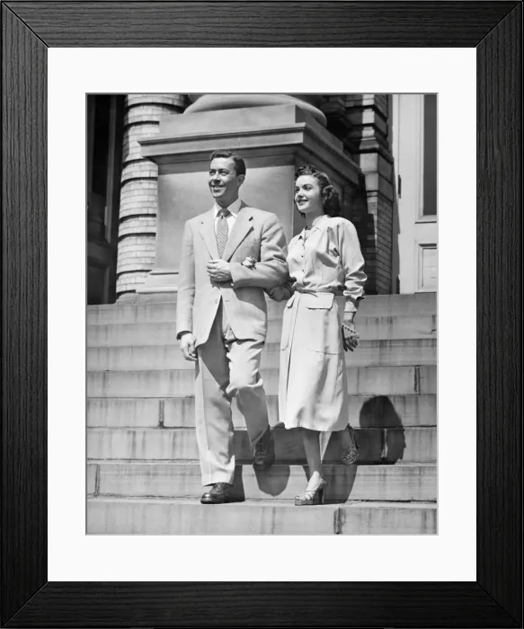 Framed Print : Elegant couple descending steps, (B&W) Framed Print : Elegant couple descending steps, (B&W)