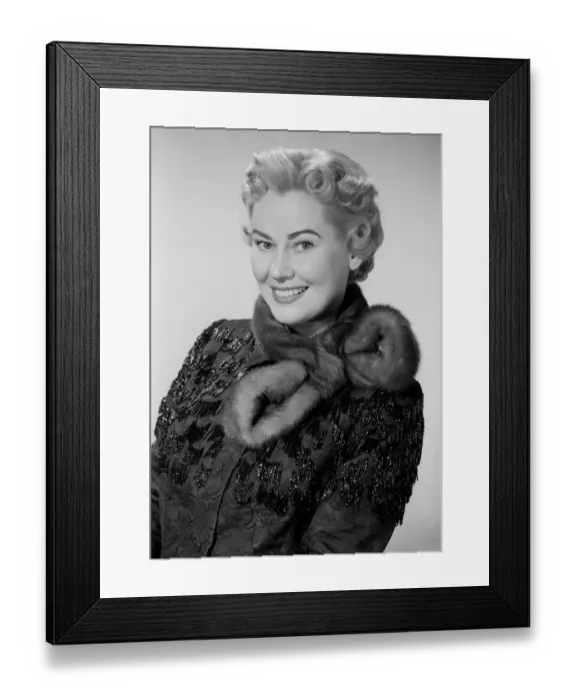 Framed Print : Studio portrait of mid adult woman wearing fur collar Framed Print : Studio portrait of mid adult woman wearing fur collar