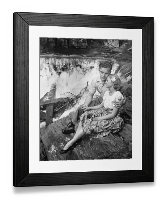 Framed Print : Young couple embracing near waterfall, (B&W) Framed Print : Young couple embracing near waterfall, (B&W)