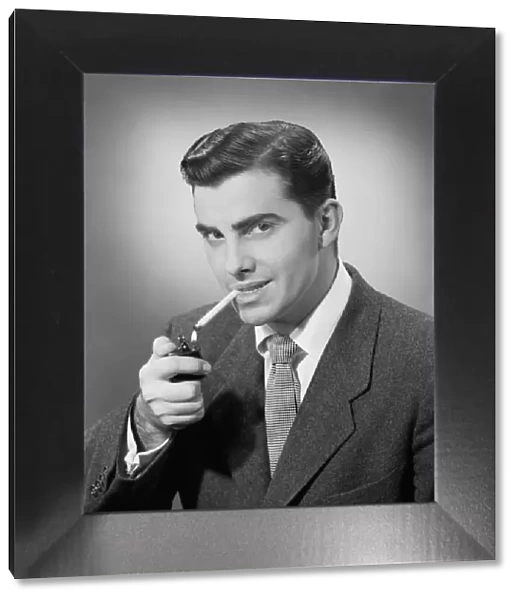 Man lighting cigarette, portrait