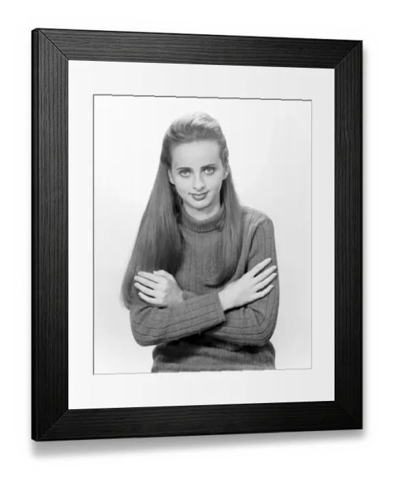 Framed Print : Portrait of young woman with arms crossed Framed Print : Portrait of young woman with arms crossed
