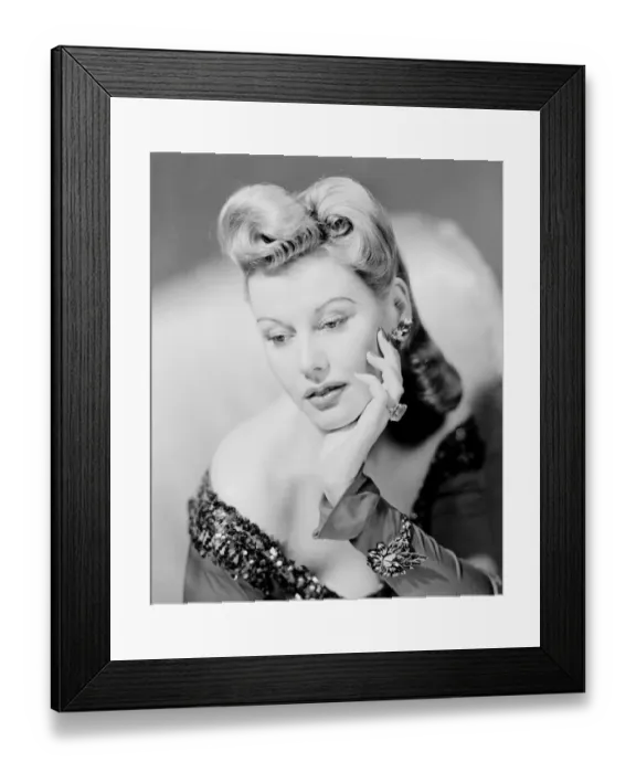Framed Print : Studio shot of mid adult woman resting head on hand Framed Print : Studio shot of mid adult woman resting head on hand