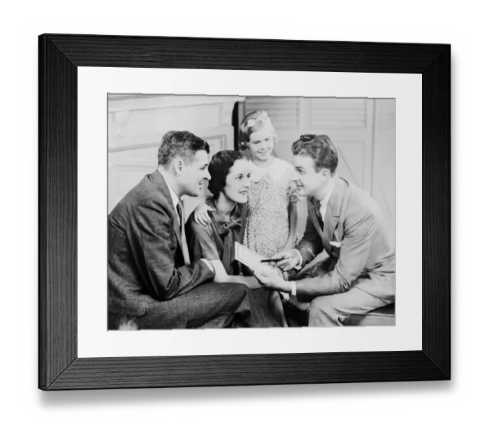 Framed Print : Parents and daughter (6-7) talking with male teacher, indoors Framed Print : Parents and daughter (6-7) talking with male teacher, indoors