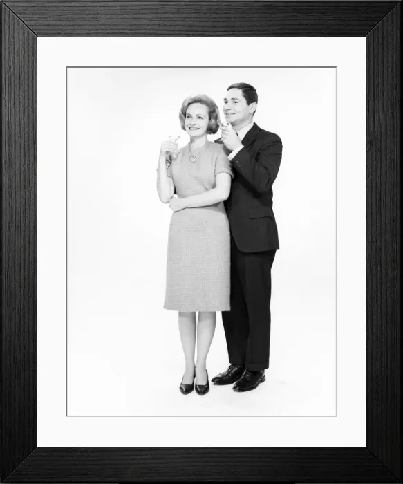 Framed Print : Mature couple drinking cocktails, studio shot Framed Print : Mature couple drinking cocktails, studio shot
