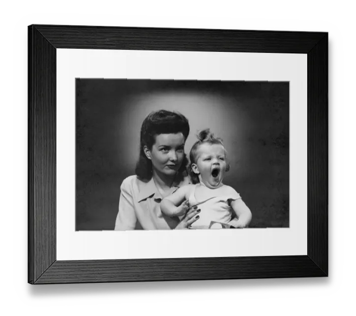 Framed Print : Studio shot of woman with yawning baby girl (6-11 months) Framed Print : Studio shot of woman with yawning baby girl (6-11 months)