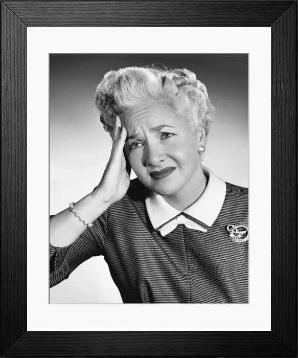 Framed Print : Woman holding forehead Framed Print : Woman holding forehead