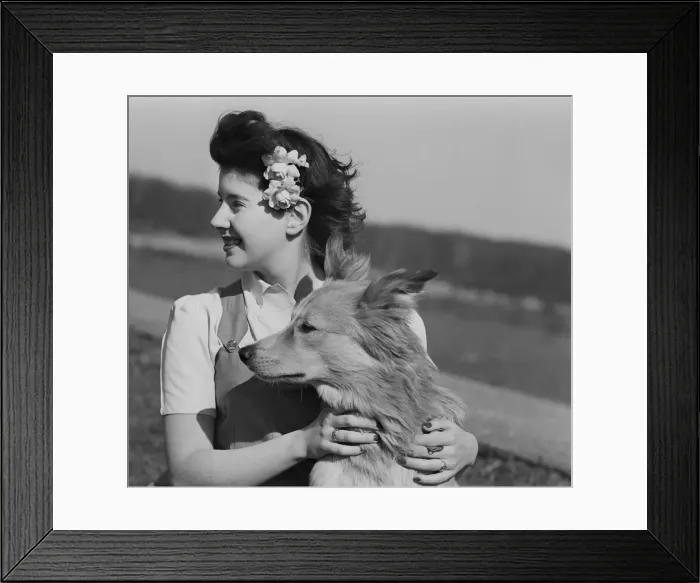 Framed Print : Young woman with dog outdoors