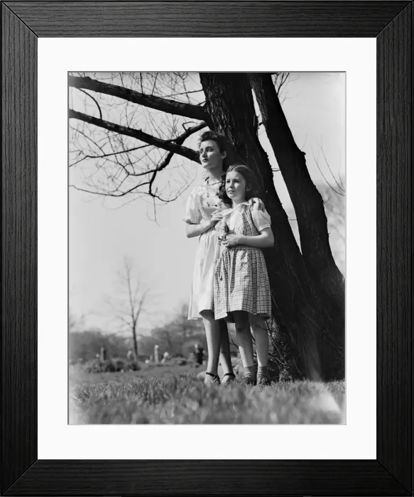 Framed Print : Mother and daughter (8-9) standing under tree Framed Print : Mother and daughter (8-9) standing under tree