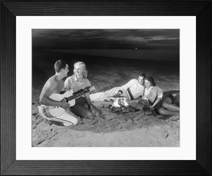 Framed Print : Two couples on beach sitting around campfire Framed Print : Two couples on beach sitting around campfire