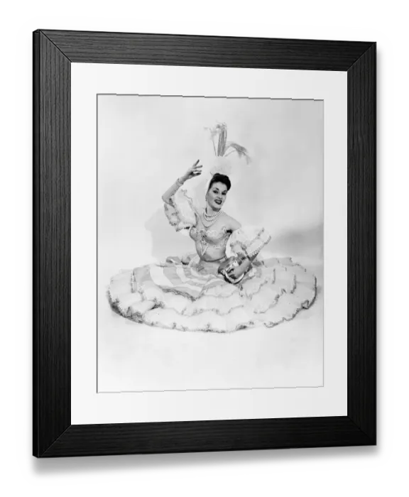 Framed Print : Woman wearing frill dress and headwear, sitting on ground, portrait Framed Print : Woman wearing frill dress and headwear, sitting on ground, portrait