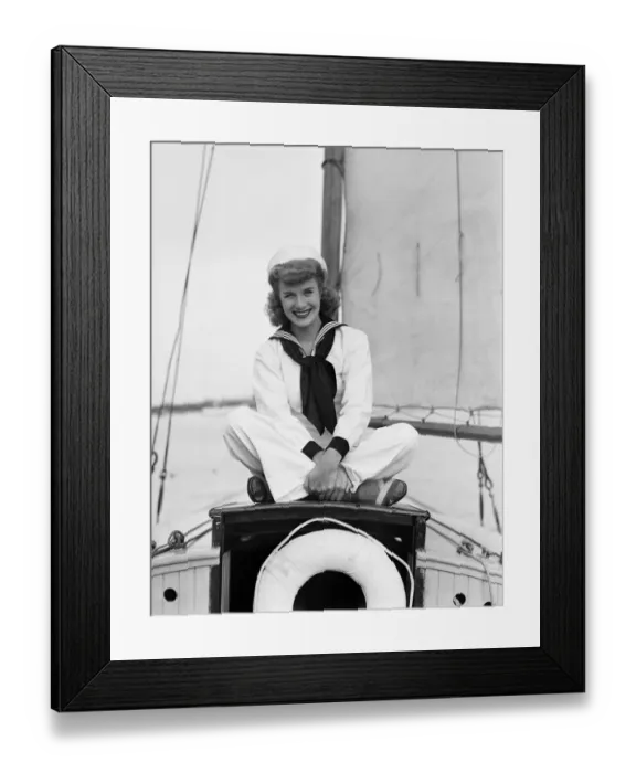 Framed Print : Portrait of young woman in sailor suit on ship Framed Print : Portrait of young woman in sailor suit on ship