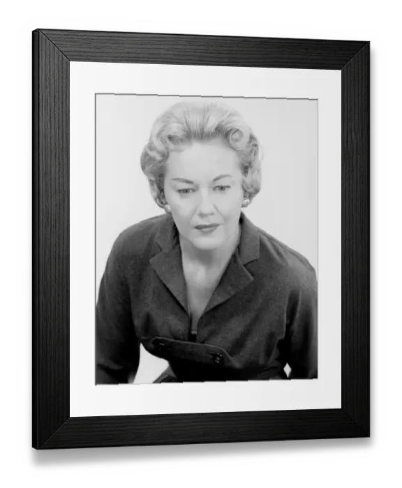 Framed Print : Studio shot of mature woman looking down