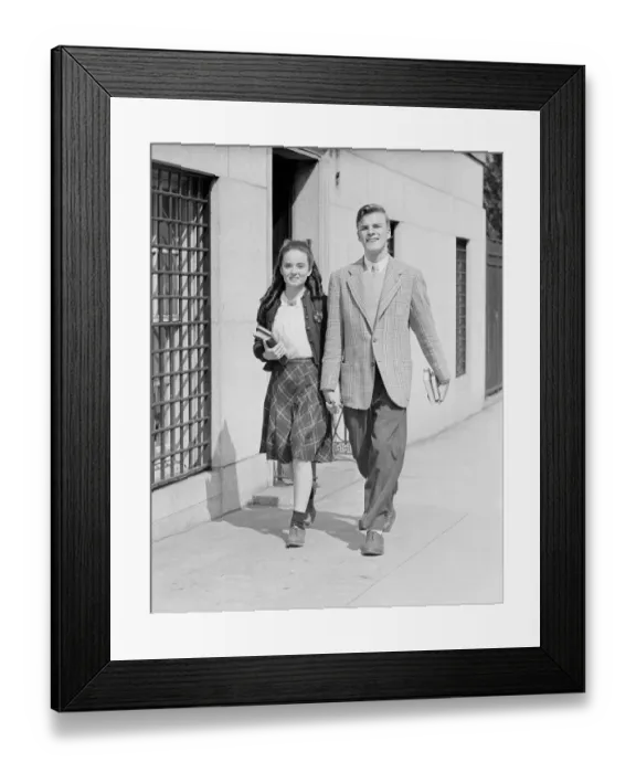 Framed Print : Young couple (17-19) walking along sidewalk Framed Print : Young couple (17-19) walking along sidewalk