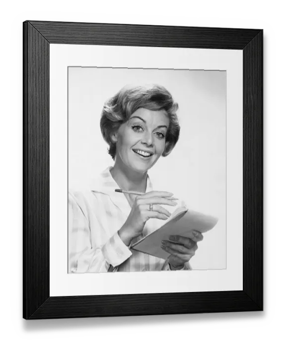 Framed Print : Woman holding pencil and paper Framed Print : Woman holding pencil and paper