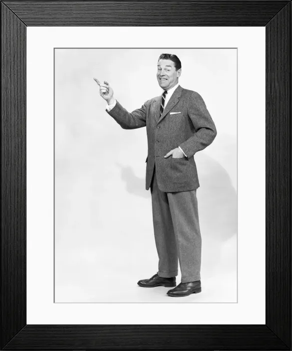 Framed Print : Mature man gesturing in studio, portrait Framed Print : Mature man gesturing in studio, portrait