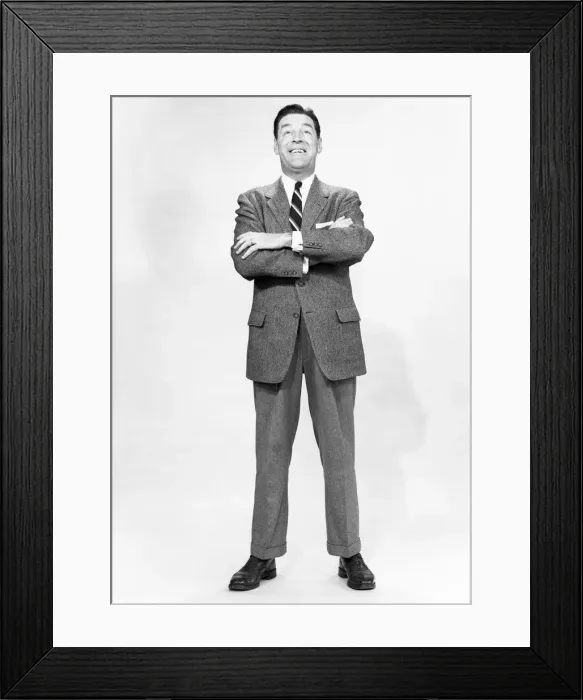 Framed Print : Mature man wearing suit, standing in studio, portrait