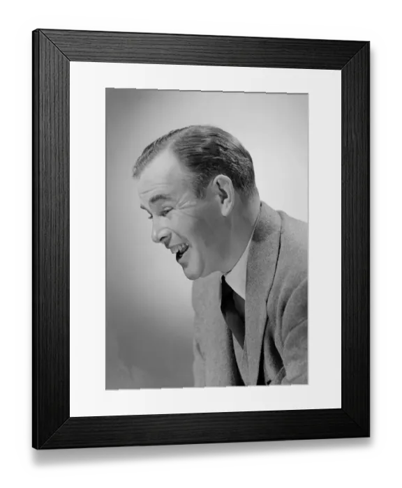 Framed Print : Studio shot of mid adult man laughing Framed Print : Studio shot of mid adult man laughing