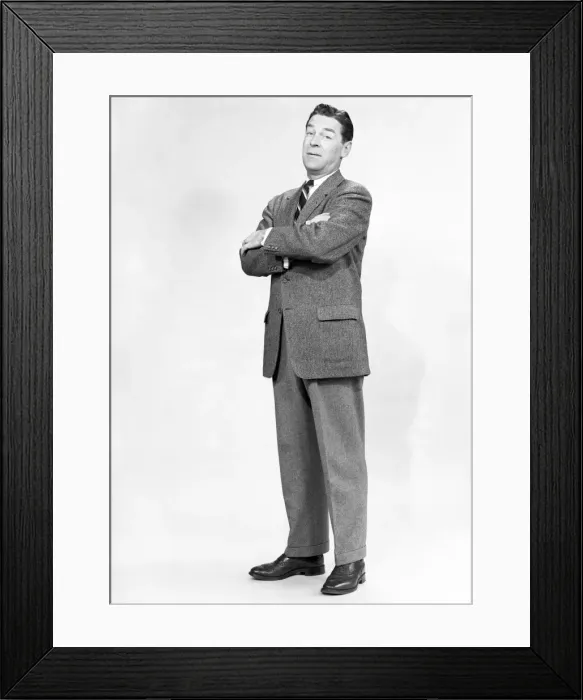 Framed Print : Mature man wearing suit, standing in studio, portrait Framed Print : Mature man wearing suit, standing in studio, portrait