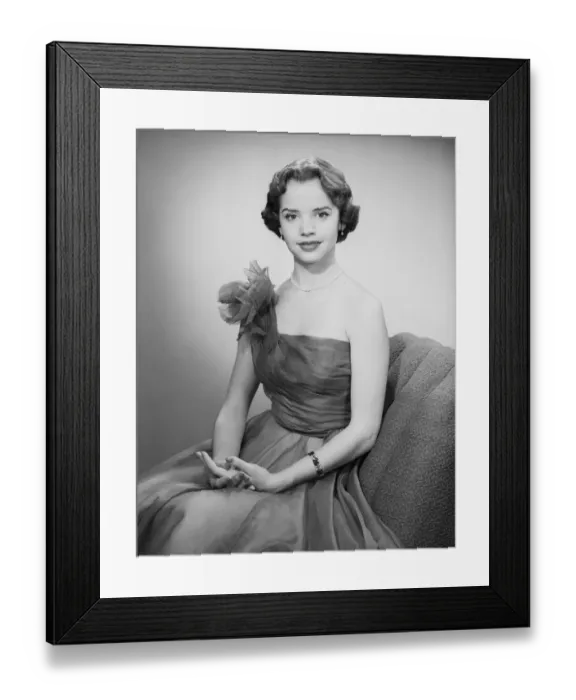 Framed Print : Woman wearing dress sitting in chair, portrait Framed Print : Woman wearing dress sitting in chair, portrait