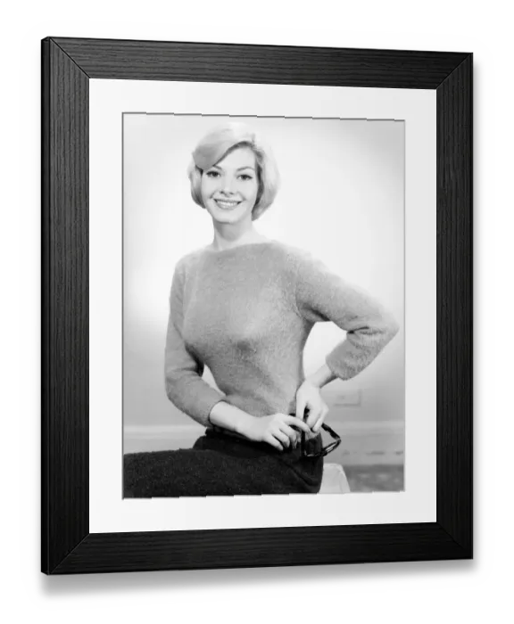 Framed Print : Studio portrait of young woman smiling Framed Print : Studio portrait of young woman smiling
