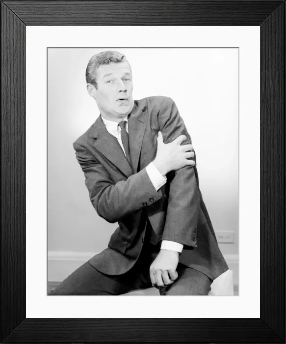 Framed Print : Studio shot of mid adult man with facial expression