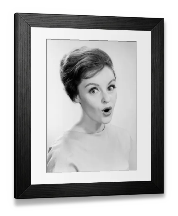 Framed Print : Studio portrait of woman with facial expression Framed Print : Studio portrait of woman with facial expression