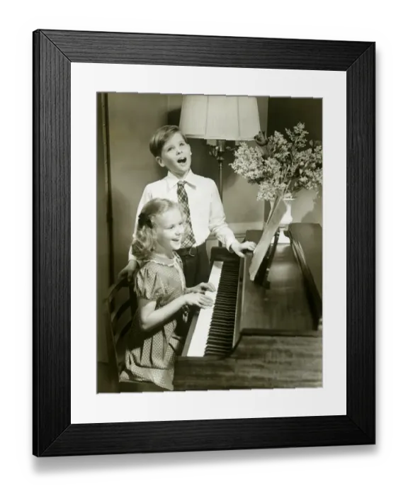 Framed Print : Boy singing beside girl playing piano Framed Print : Boy singing beside girl playing piano