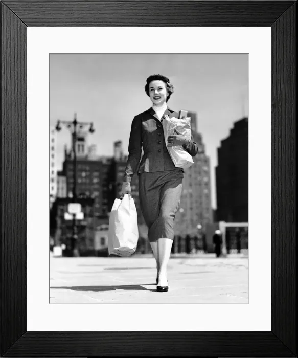 Framed Print : Woman walking, carrying bag Framed Print : Woman walking, carrying bag