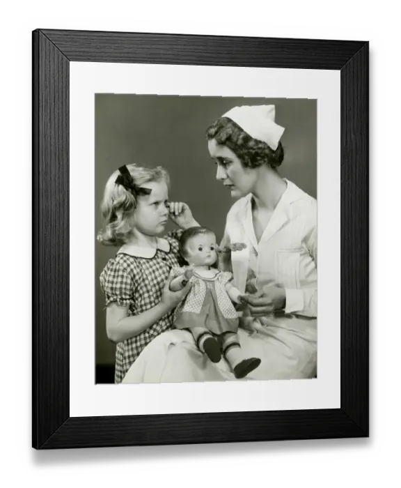 Framed Print : Young girl and nurse holding doll Framed Print : Young girl and nurse holding doll