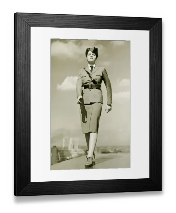 Framed Print : Young woman in military outfit marching on rooftop, portrait