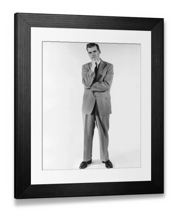 Framed Print : Man standing, rubbing chin Framed Print : Man standing, rubbing chin