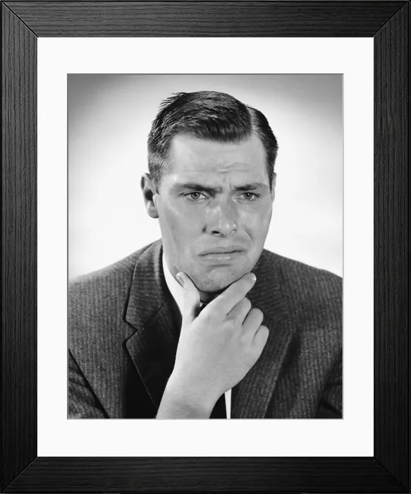 Framed Print : Man rubbing chin Framed Print : Man rubbing chin