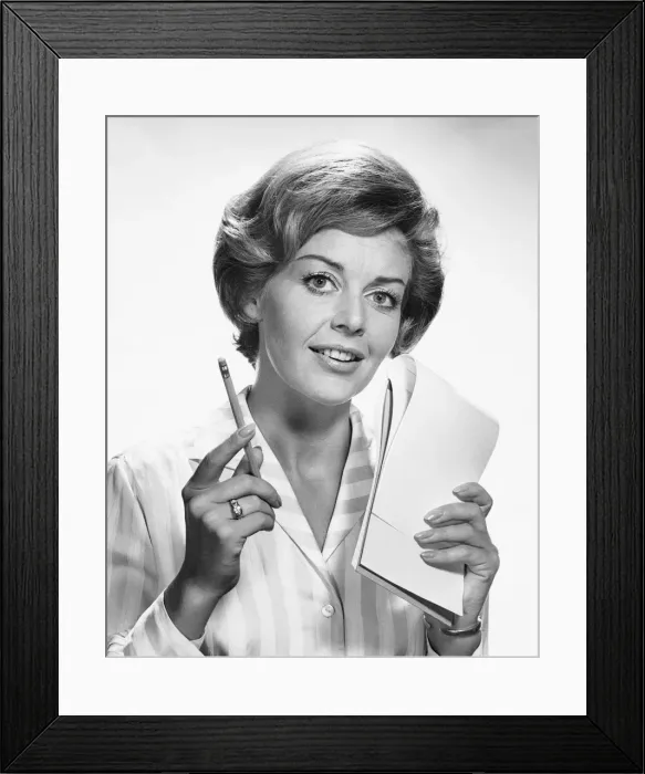 Framed Print : Woman holding pencil and paper