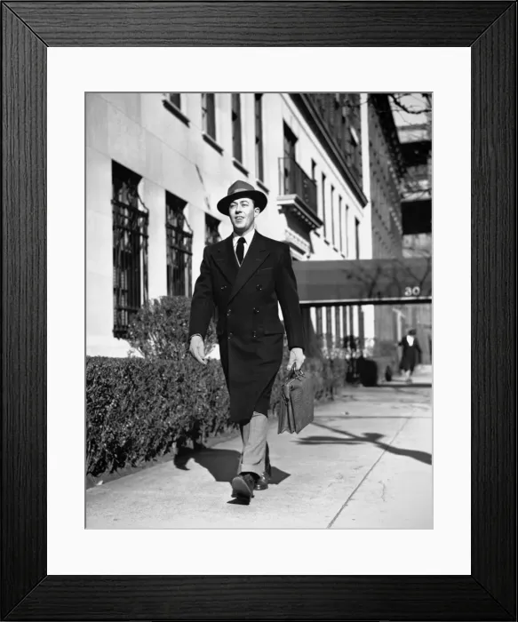 Framed Print : Man in overcoat walking on sidewalk, (B&W) Framed Print : Man in overcoat walking on sidewalk, (B&W)