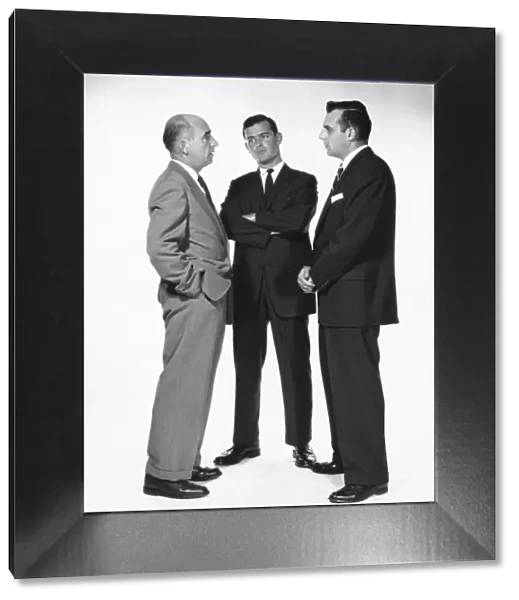 Three men talking