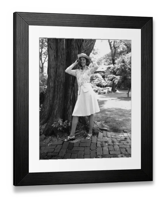 Framed Print : Young woman standing by tree in park, (B&W), portrait Framed Print : Young woman standing by tree in park, (B&W), portrait
