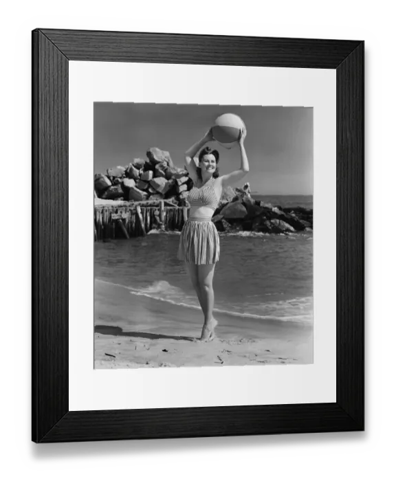 Framed Print : Woman holding ball on beach, (B&W) Framed Print : Woman holding ball on beach, (B&W)