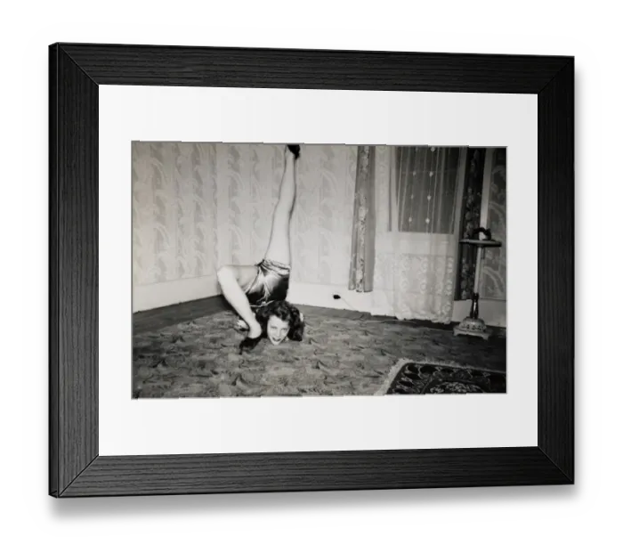 Framed Print : Flexible Woman on the Living Room Floor With Her Leg Over Her Head Framed Print : Flexible Woman on the Living Room Floor With Her Leg Over Her Head