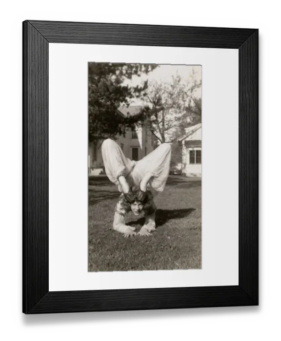 Framed Print : Flexible Woman in a Garden Bending Her Legs Above Her Head Framed Print : Flexible Woman in a Garden Bending Her Legs Above Her Head