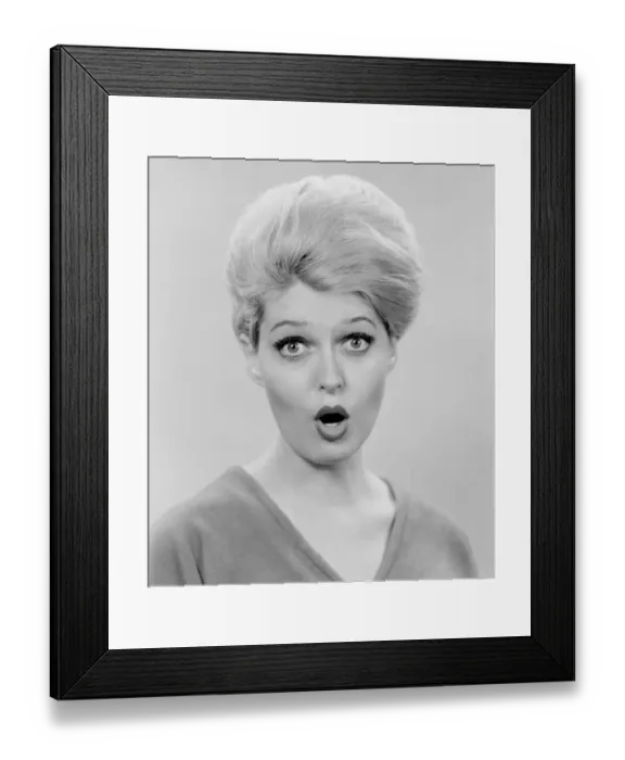 Framed Print : Studio portrait of mid adult woman with facial expression Framed Print : Studio portrait of mid adult woman with facial expression