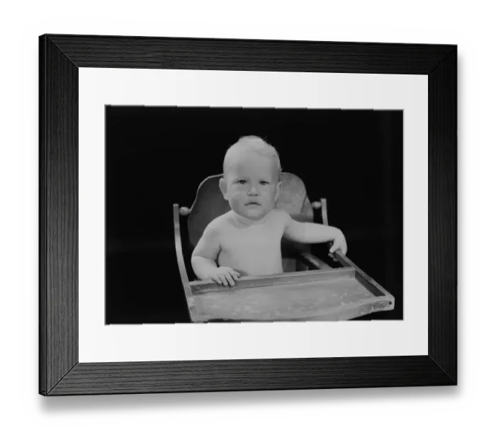 Framed Print : Portrait of baby boy (6-11 months) sitting in high chair Framed Print : Portrait of baby boy (6-11 months) sitting in high chair