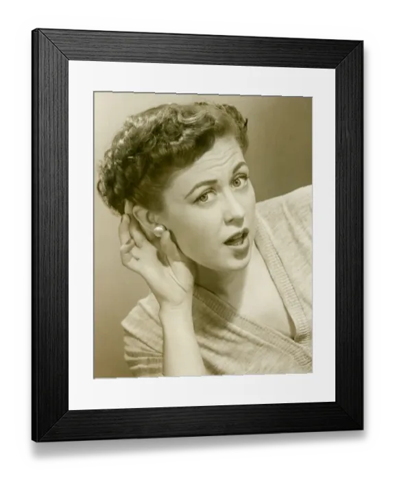 Framed Print : Woman cupping hand to ear, portrait