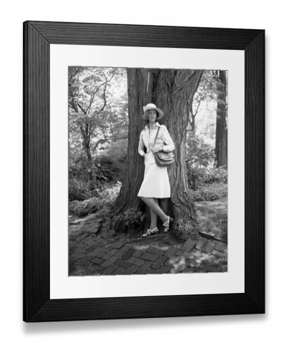 Framed Print : Young woman leaning by tree, (B&W)