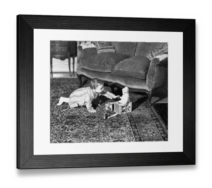 Framed Print : Baby girl (6-9 months) playing on floor, (B&W) Framed Print : Baby girl (6-9 months) playing on floor, (B&W)