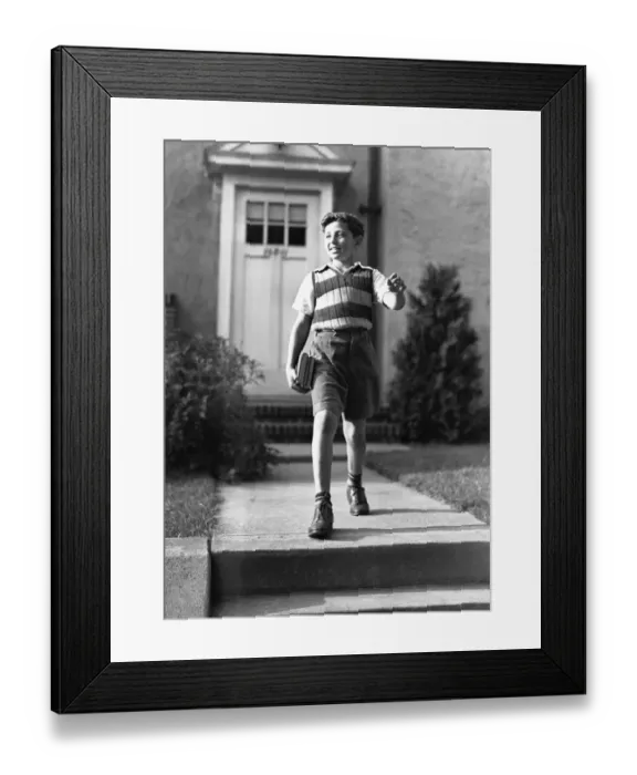 Framed Print : Boy (10-11) on way to school, (B&W) Framed Print : Boy (10-11) on way to school, (B&W)