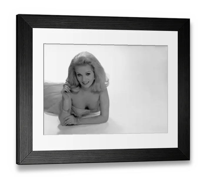 Framed Print : Smiling woman posing in studio, (B&W), portrait Framed Print : Smiling woman posing in studio, (B&W), portrait