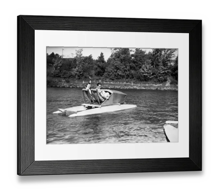 Framed Print : Two men in water pedalo, (B&W) Framed Print : Two men in water pedalo, (B&W)