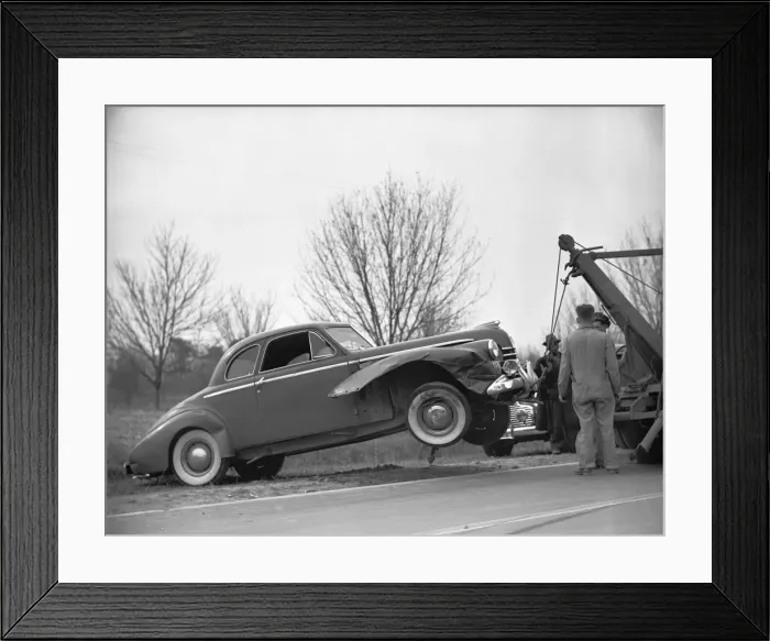 Framed Print : Tow truck lifting broken car, (B&W) Framed Print : Tow truck lifting broken car, (B&W)